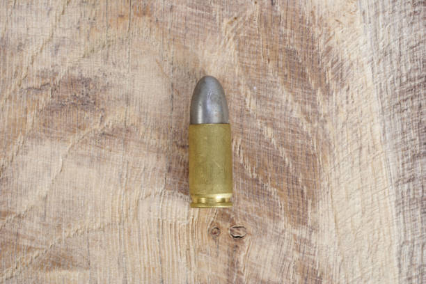 istock The 9mm caliber cartridge on wooden background 1020777050