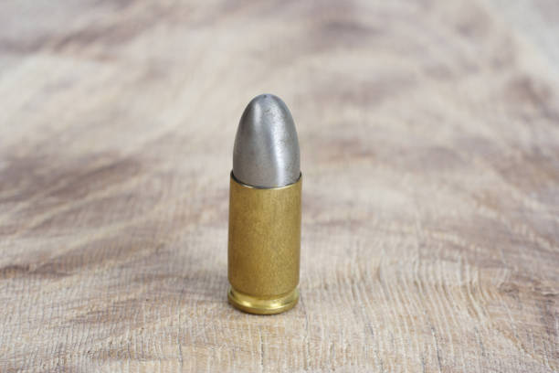 istock The 9mm caliber cartridge on wooden background 1020777088