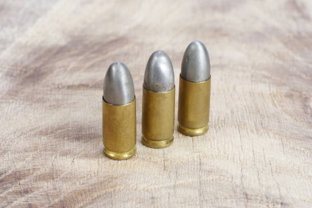 istock The 9mm caliber cartridge on wooden background 1020777094