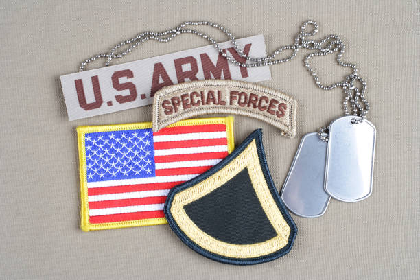 istock US ARMY Private First Class rank patch, special forces tab, flag patch and dog tag 1020782826