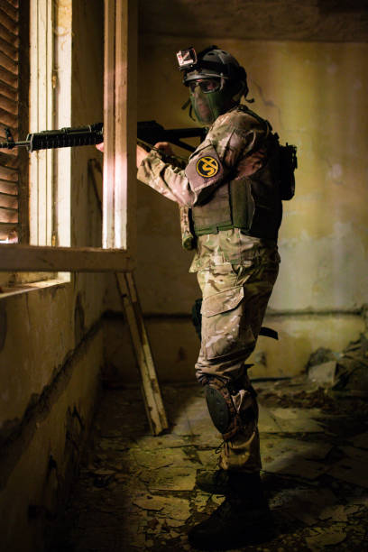 istock Soldier with rifle ready to fire 1020799002