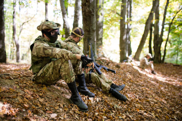 istock Soldier with airsoft gun resting after battle 1020803338