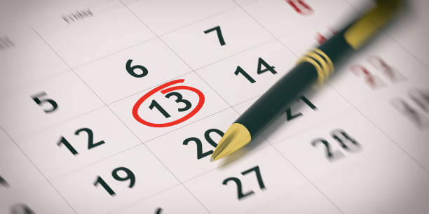istock Ballpoint pen on a planner - day 13 circled. 3d illustration 1020803340