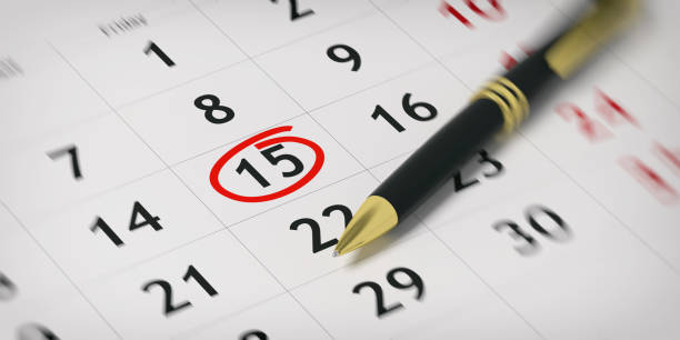 Ballpoint pen on a planner - day 15 circled. 3d illustration Black ballpoint pen on a calendar and day 15 circled. 3d illustration calendar date circled stock pictures, royalty-free photos & images