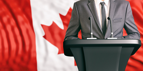 Businessman or politician making speech on Canada flag background. 3d illustration