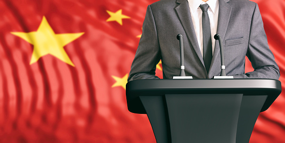 Businessman or politician making speech on China flag background. 3d illustration