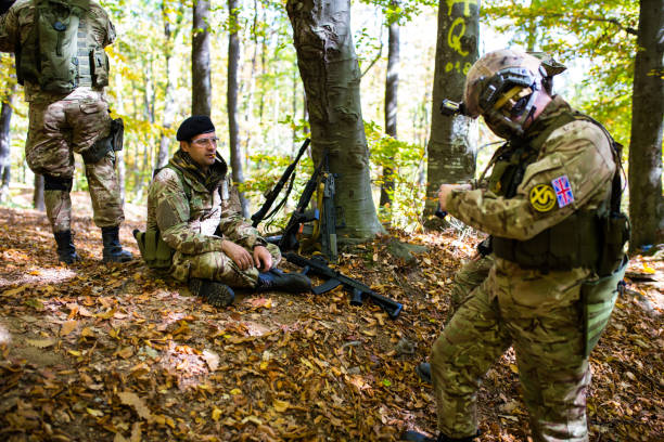 istock Soldier with airsoft gun resting after battle 1020803370