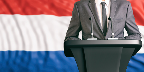 Businessman or politician making speech on Netherlands flag background. 3d illustration