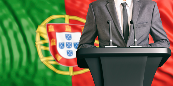 Businessman or politician making speech on Portugal flag background. 3d illustration