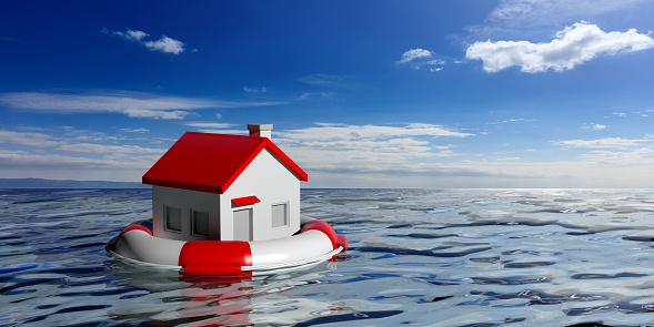 Boya de vida y una casa pequeña en el fondo azul del mar. Ilustración 3D photo