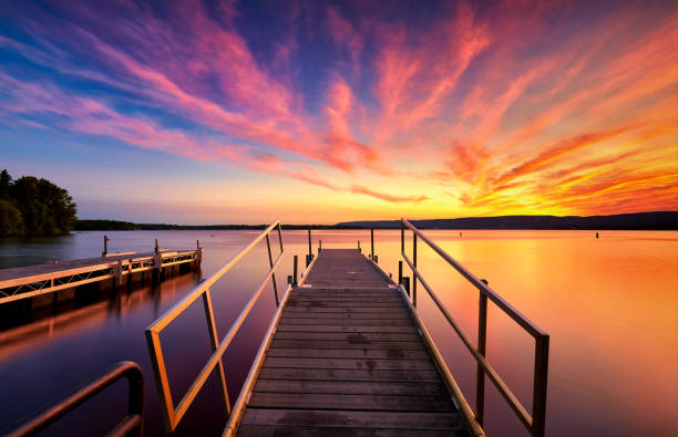 istock Fantastic sunset beautiful pink clouds with reflexion and bridge 1020803862
