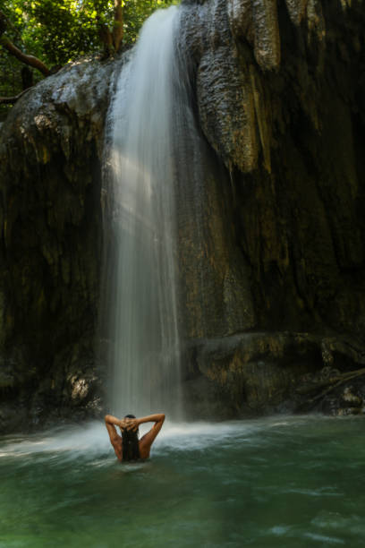 istock Woman in bikini at waterfall 1020808370