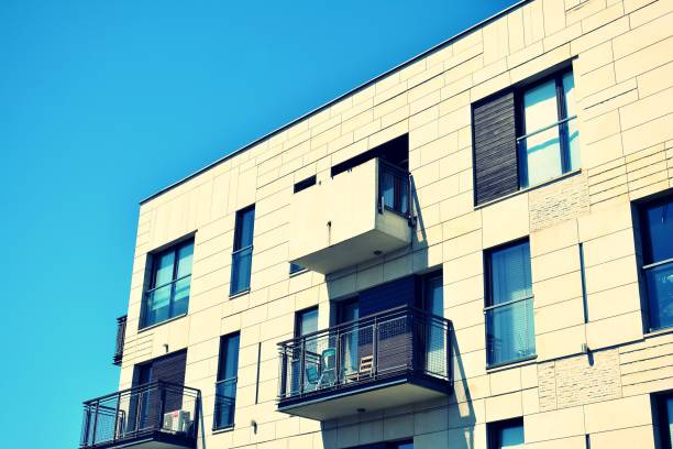 istock Modern apartment building exterior. Retro colors stylization 1020810976