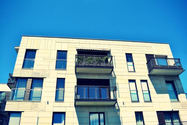 istock Modern apartment building exterior. Retro colors stylization 1020813990