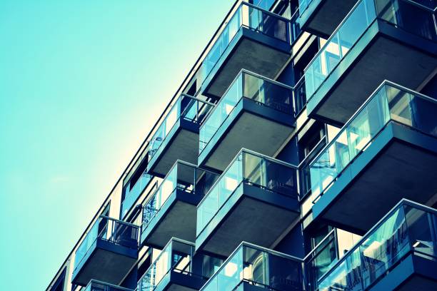 istock Modern apartment building exterior. Retro colors stylization 1020814374