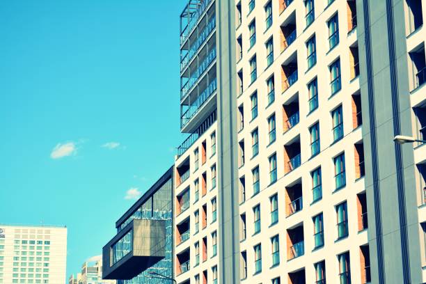 istock Modern apartment building exterior. Retro colors stylization 1020818704