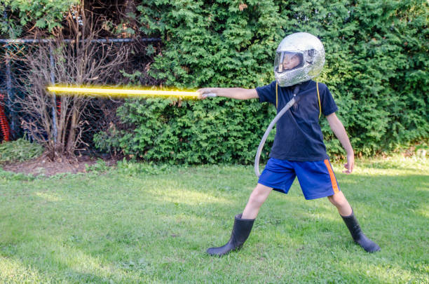 istock Young boy dressed as an astronaut in the backyard during summer day 1020819130
