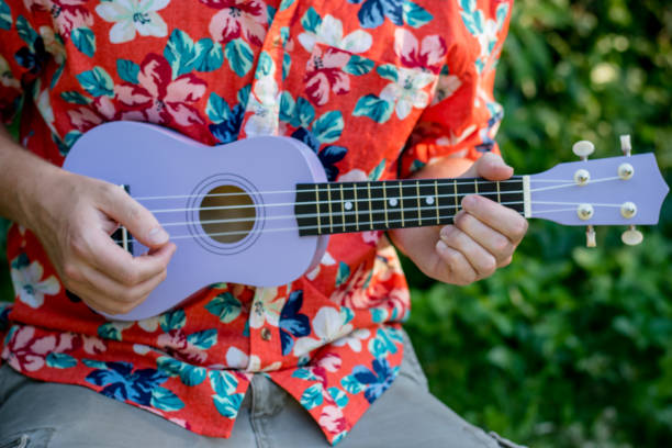 istock man with hawaiian shirt and ukulele 1020837156