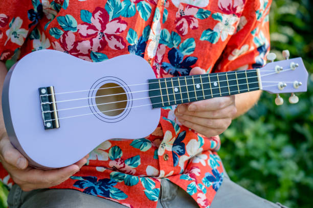istock man with hawaiian shirt and ukulele 1020837160