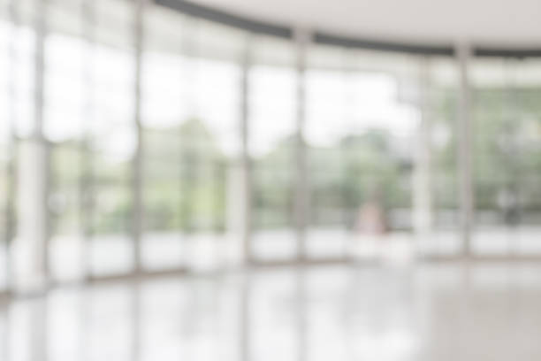 istock Blur abstract background interior view empty office lobby with entrance doors and glass curtain wall 1020849470
