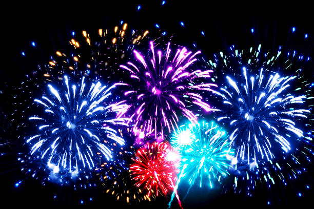 istock FESTIVE BRIGHT BACKGROUND WITH MULTICOLORED FIREWORKS,FIREWORKS,EXPLOSION OF LIGHT,A DAY OF REST 1020855114