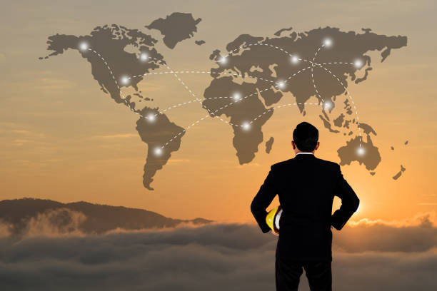 istock Business Collaboration Concept, World data link connection with male engineer stands in the sunset background for design 1020856636