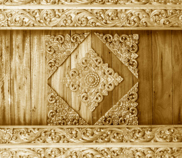 istock flower carved on wood background 1020860048