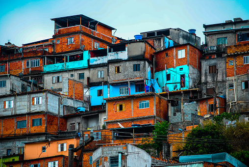 A cluster of colored masonry and wooden houses on the outskirts of SP Brazil