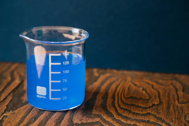 istock Glass measuring beaker in Laboratory, Science experiment concept 1020915956