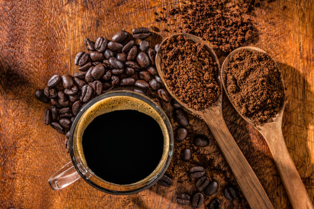 istock Three wooden spoons with coffee beans, instant coffee and grinded coffee in jute frame 1020922894