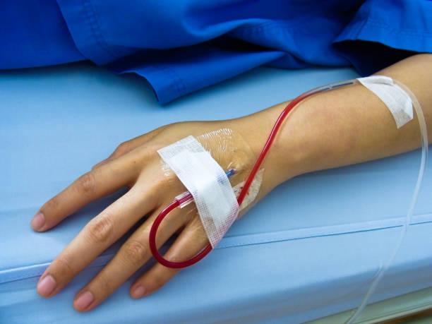 istock Patient's hand which has blood in rubber tube 1020922994