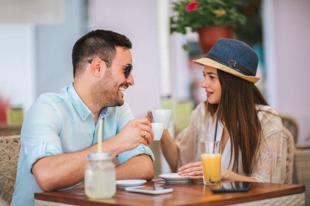 istock Beautiful couple having coffee on a date 1020947828
