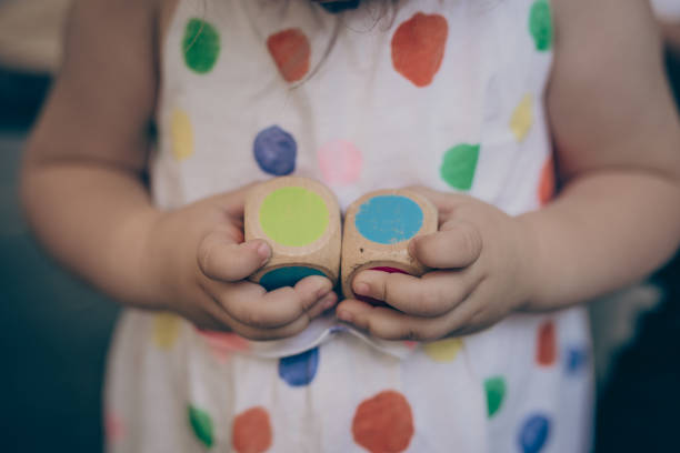 istock Wooden dice in child hands 1020949946