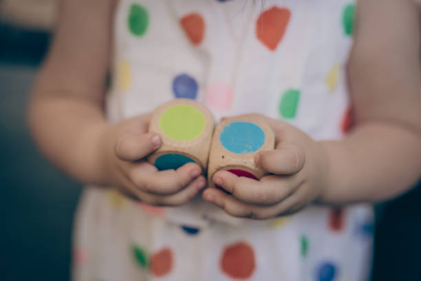 istock Wooden dice in child hands 1020949954