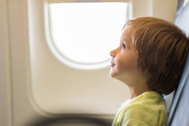 istock Side view cute little boy in airplane 1020955192