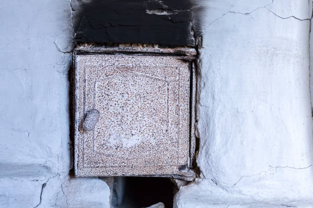 white oven wall in black soot, charred mark. old oven door - fire heat ornate dirty imagens e fotografias de stock