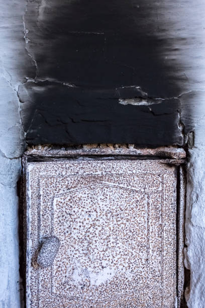 white oven wall in black soot, charred mark. old oven door - fire heat ornate dirty imagens e fotografias de stock