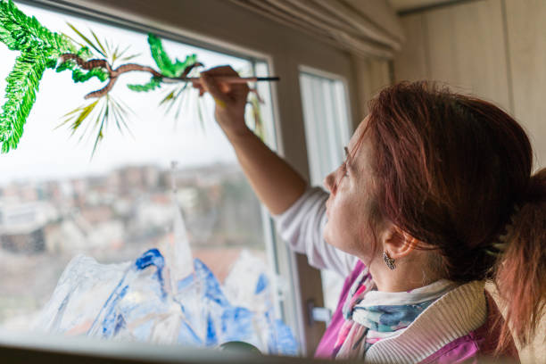 istock Woman with paintbrush 1020960786