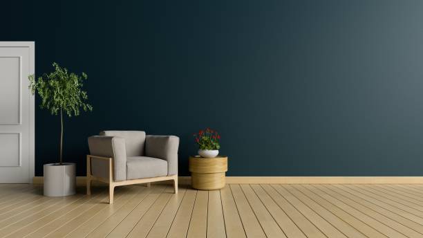istock Living room with armchair and tree on dark wall background 1020963248