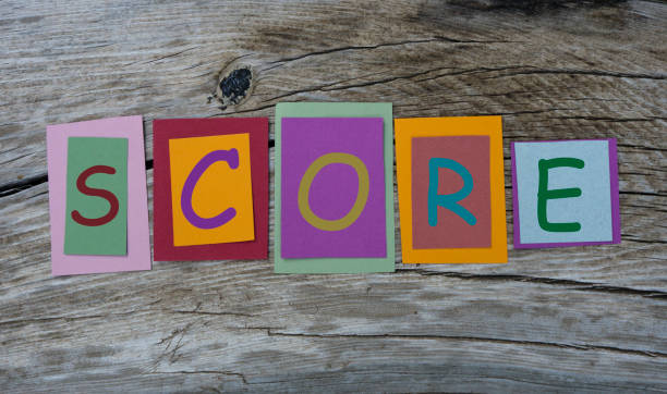 istock Score word written on colorful sticky notes on wooden background. 1020968930