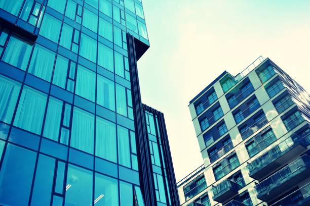 istock Modern apartment building exterior. Retro colors stylization 1020972518