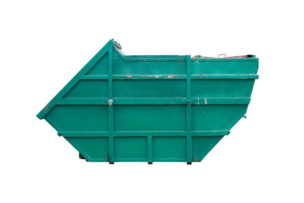 Large old iron trash painted green to prevent rust isolated on white background with clipping path. Trash is used for installation on garbage trucks.