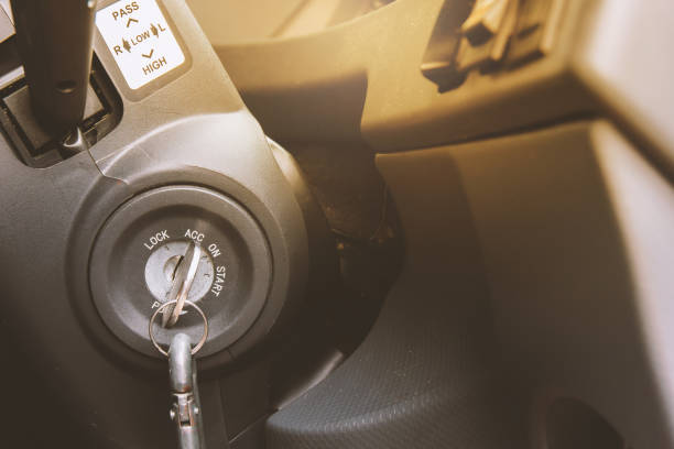 istock Old car keys impale into the keyhole under the steering wheel. 1020982160