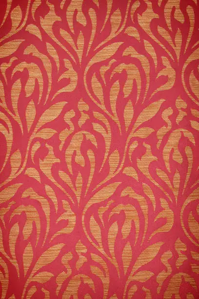 Photo of red vintage fabric with gold decor