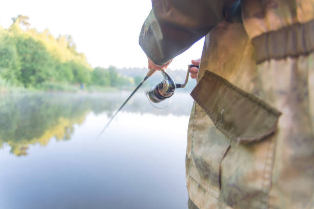 istock The man, who was fishing with spinning. 1020995196
