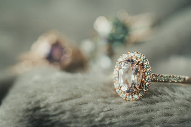 istock Jewelry luxury diamond ring closeup on fabric texture background 1020998618