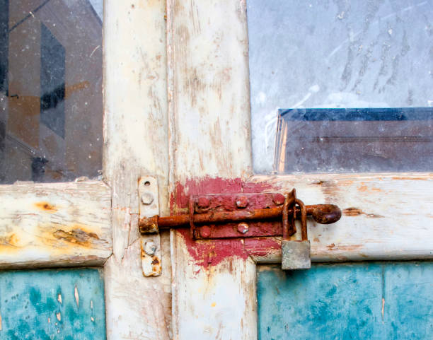 istock Old Door with latch and padlock 1021000840