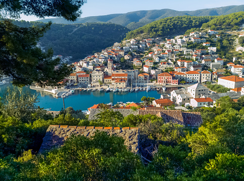 A view of the small coastal Croatian town of Pucisca on the island of Brac, Dalmatia, Croatia.
Sunny summer morning. Holidays travel destination.