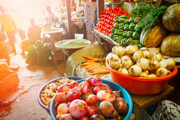 Vegetables, greens and legumes for sale at a street market counter. Source of healthy food.