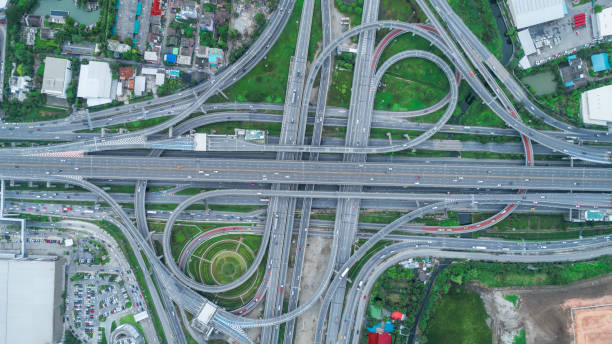 istock Aerial view highway road intersection at dusk for transportation, distribution or traffic background. 1021008796